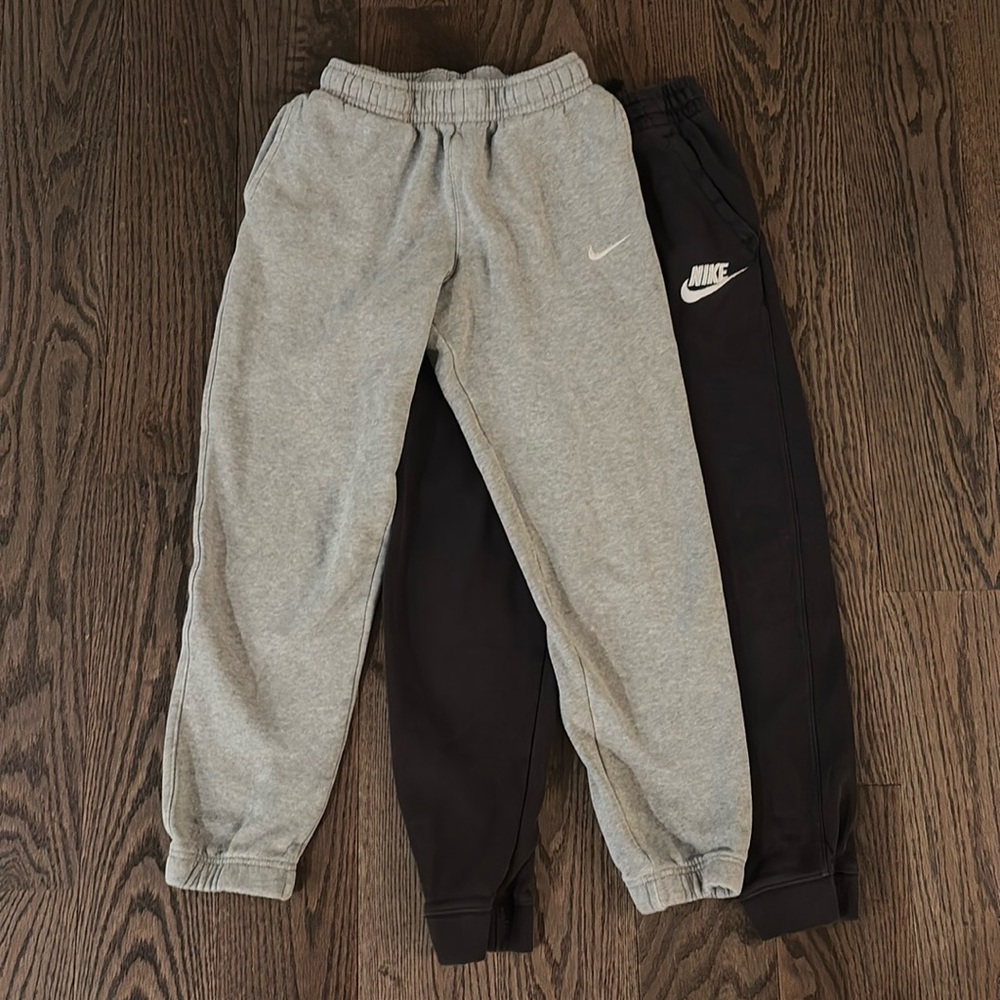Two pairs of Boys fleece Nike Joggers in L and XL